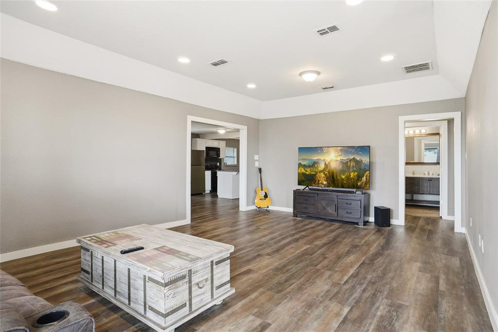207 School House Road Paradise, TX 76073 - Photo 5 of 33 a living room with furniture and a flat screen tv