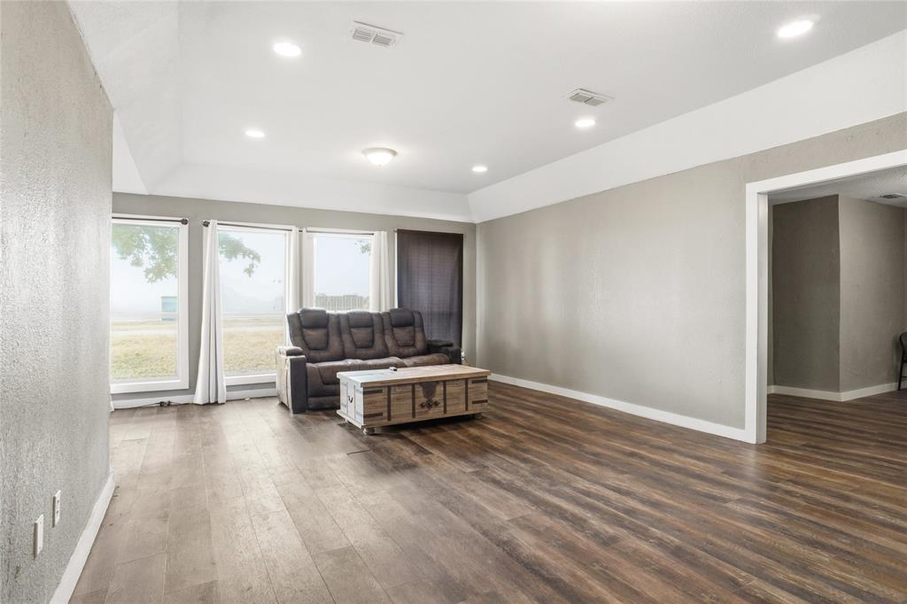 207 School House Road Paradise, TX 76073 - Photo 7 of 33 a living room with furniture and wooden floor
