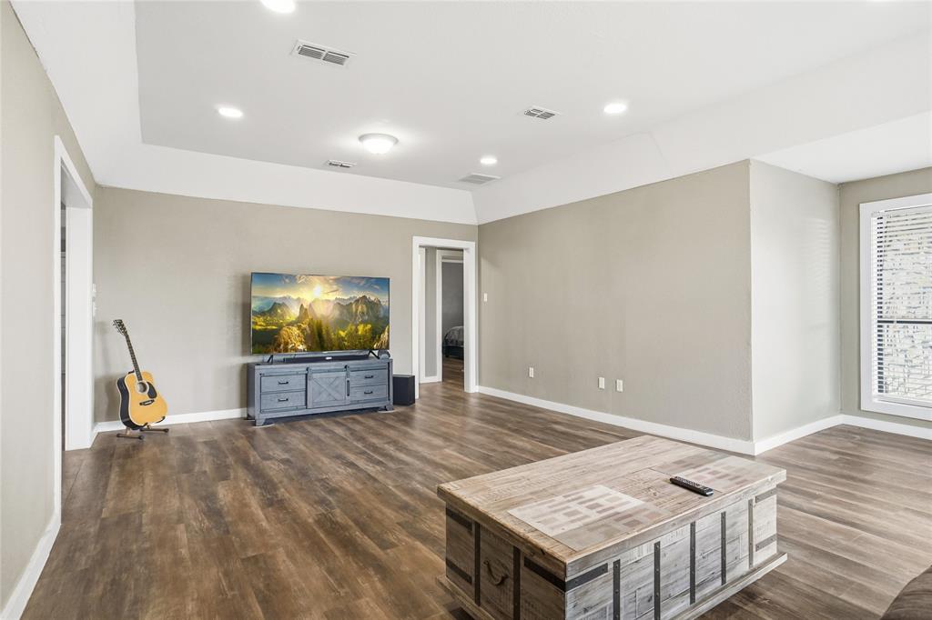 207 School House Road Paradise, TX 76073 - Photo 8 of 33 a living room with furniture and a flat screen tv