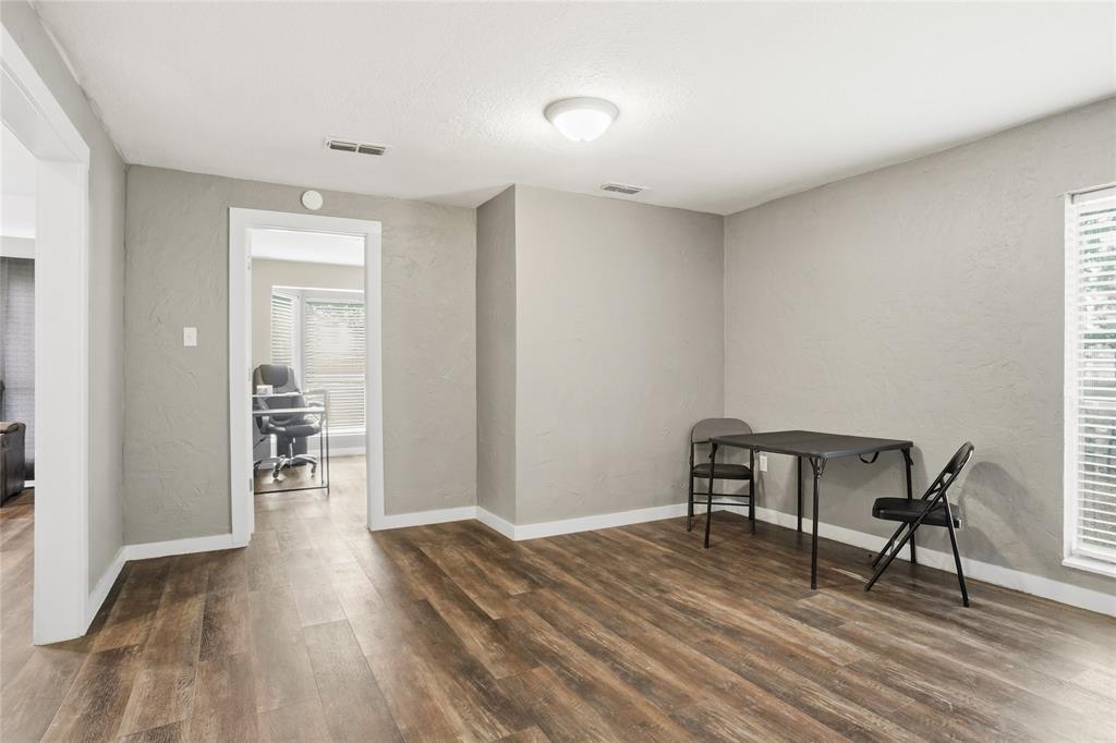 207 School House Road Paradise, TX 76073 - Photo 9 of 33 a view of a room with wooden floor lounge chair and windows