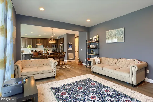 a living room with furniture and a rug