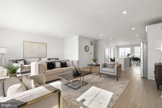 a living room with furniture and a table