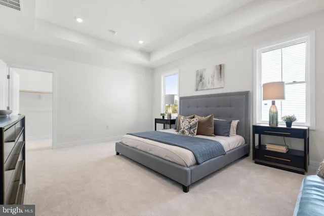 a bed room with a bed and a night stand