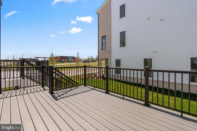a view of balcony with wooden floor