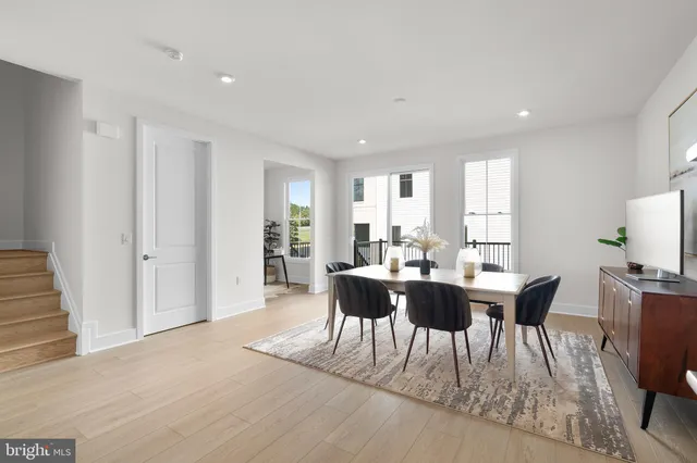a view of a dining room with furniture and window