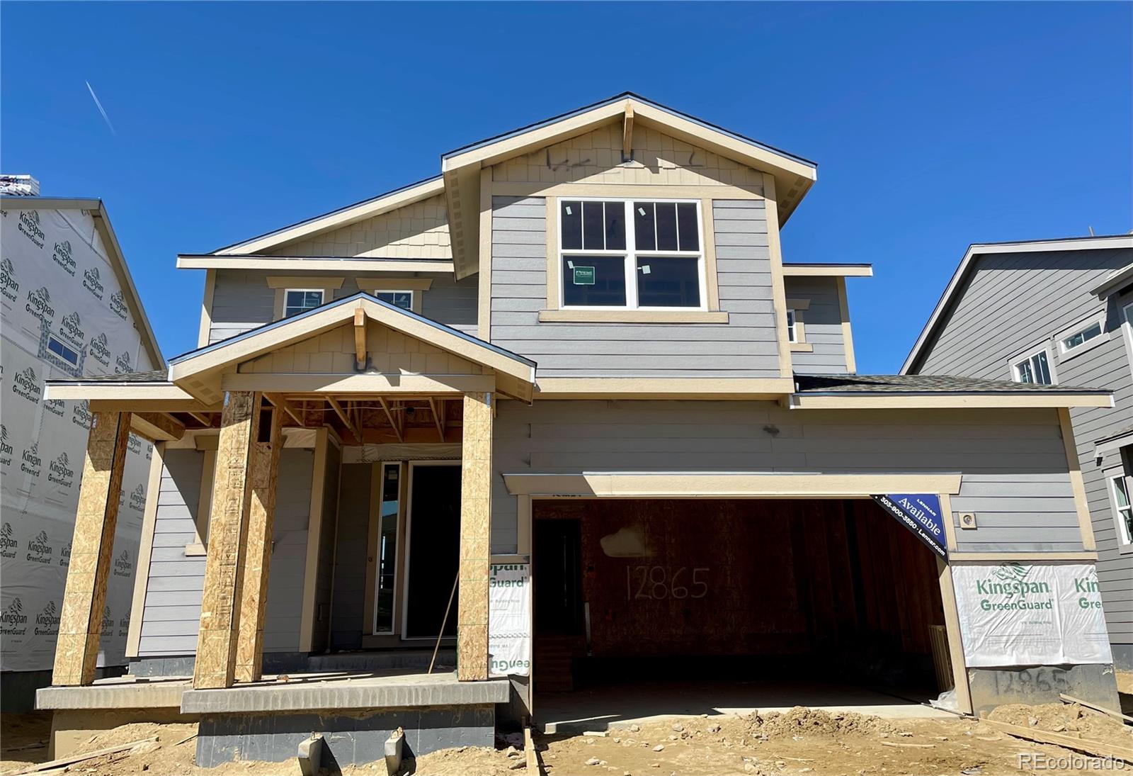 12865 Bay Street Firestone, CO 80504 - Photo 1 of 22 a front view of a house with a garage