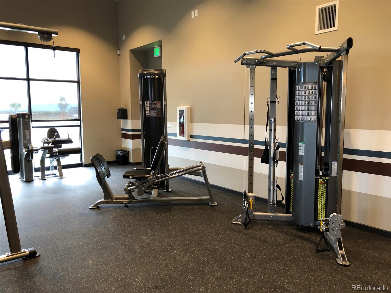 12865 Bay Street Firestone, CO 80504 - Photo 16 of 22 a view of a room with gym equipment