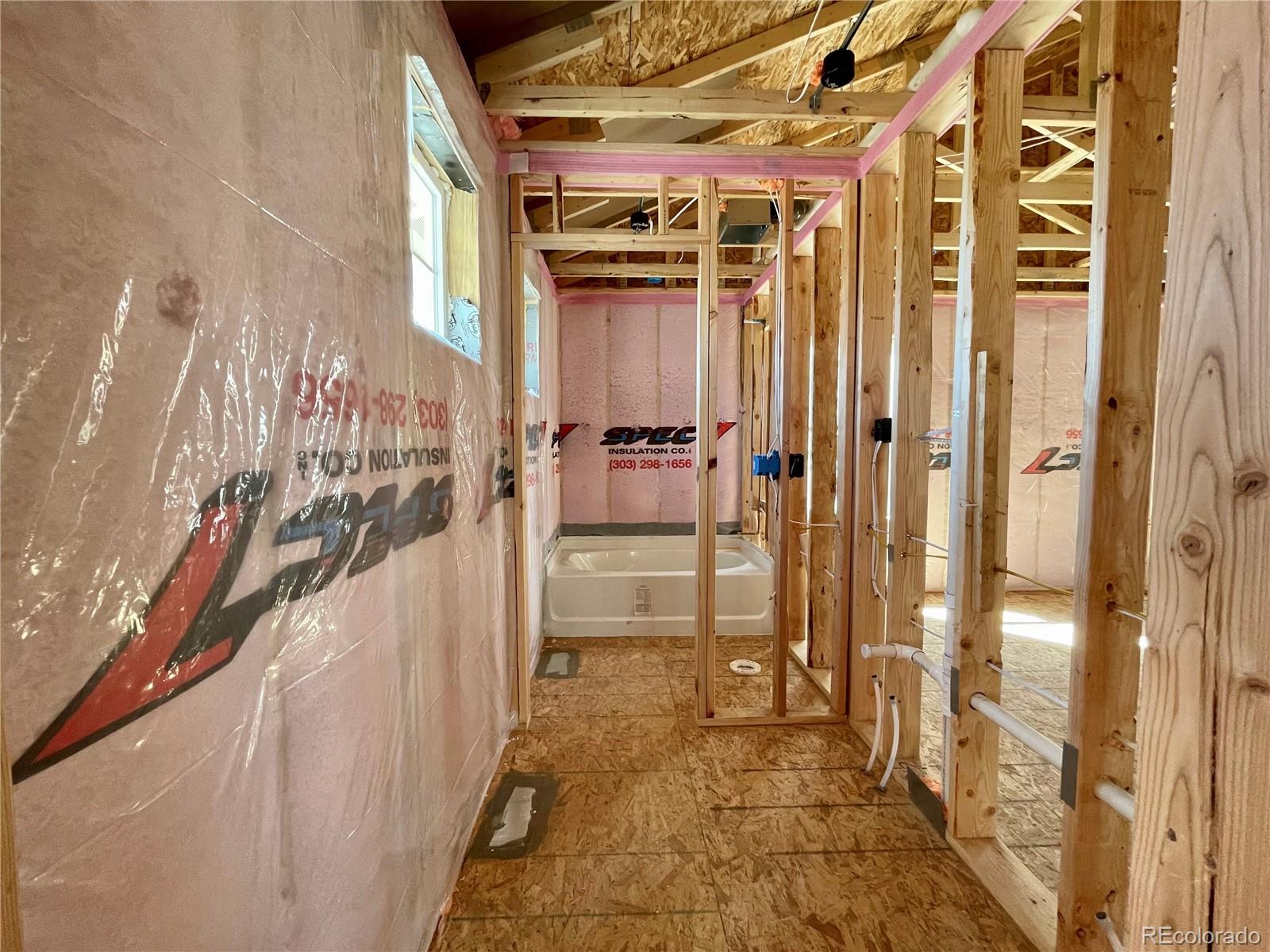 12865 Bay Street Firestone, CO 80504 - Photo 7 of 22 a view of a bathroom with tub and shower