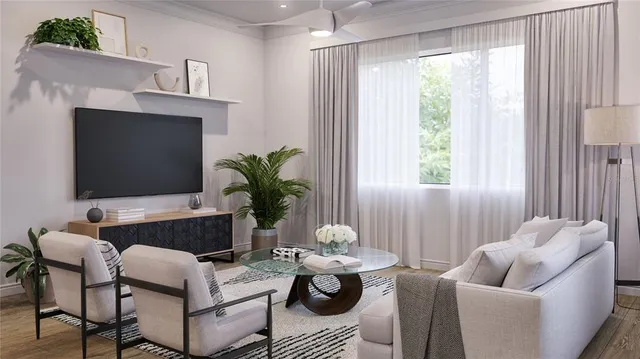 a kitchen with granite countertop white cabinets and stainless steel appliances