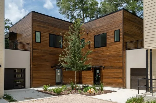 a front view of a house with garage