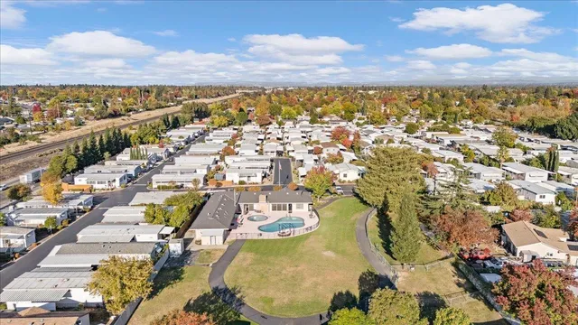 an aerial view of residential houses with outdoor space