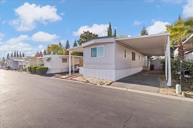 a view of a house with a street