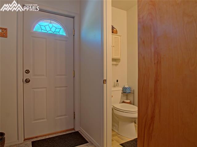 6890 Rio Road Peyton, CO 80831 - Photo 20 of 26 The 1/2 bath and door to the back yard