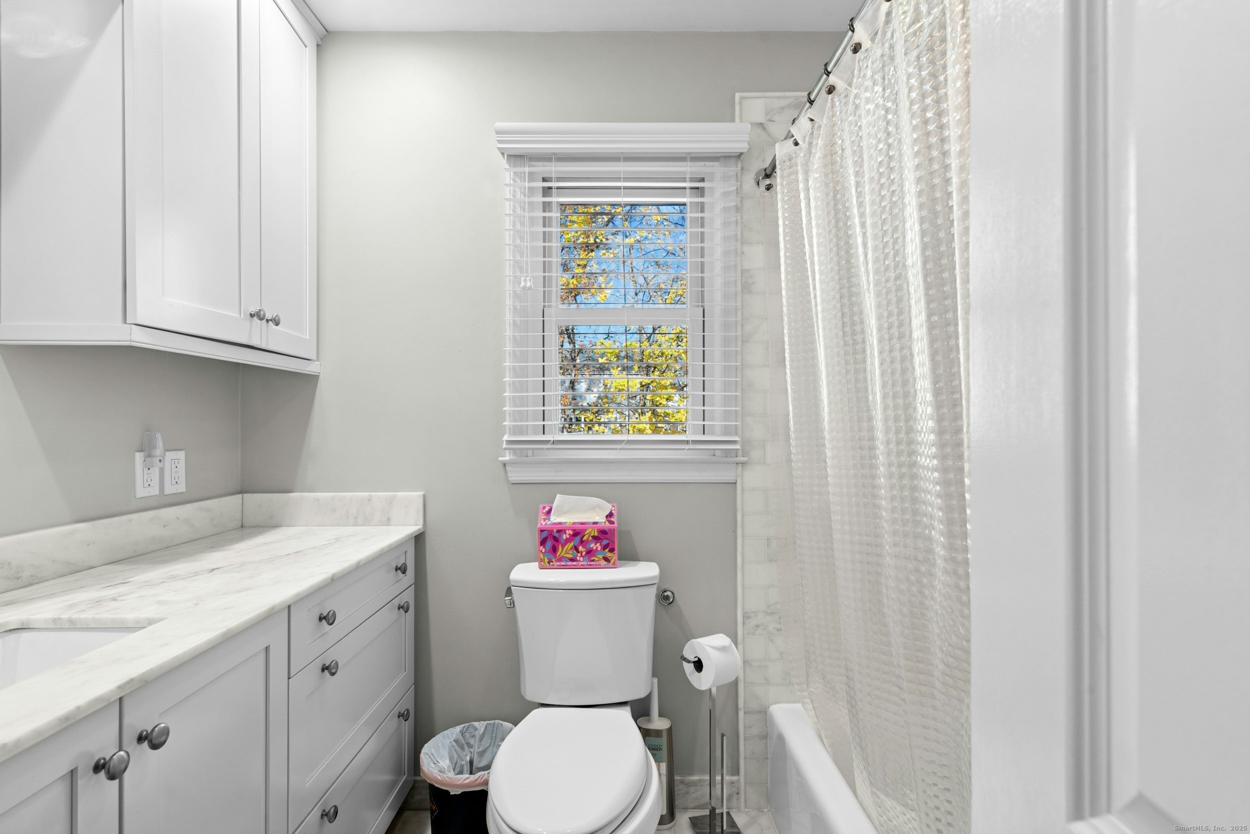 85 Hirsch Road Stamford, CT 06905 - Photo 17 of 27 a bathroom with a granite countertop toilet sink and shower