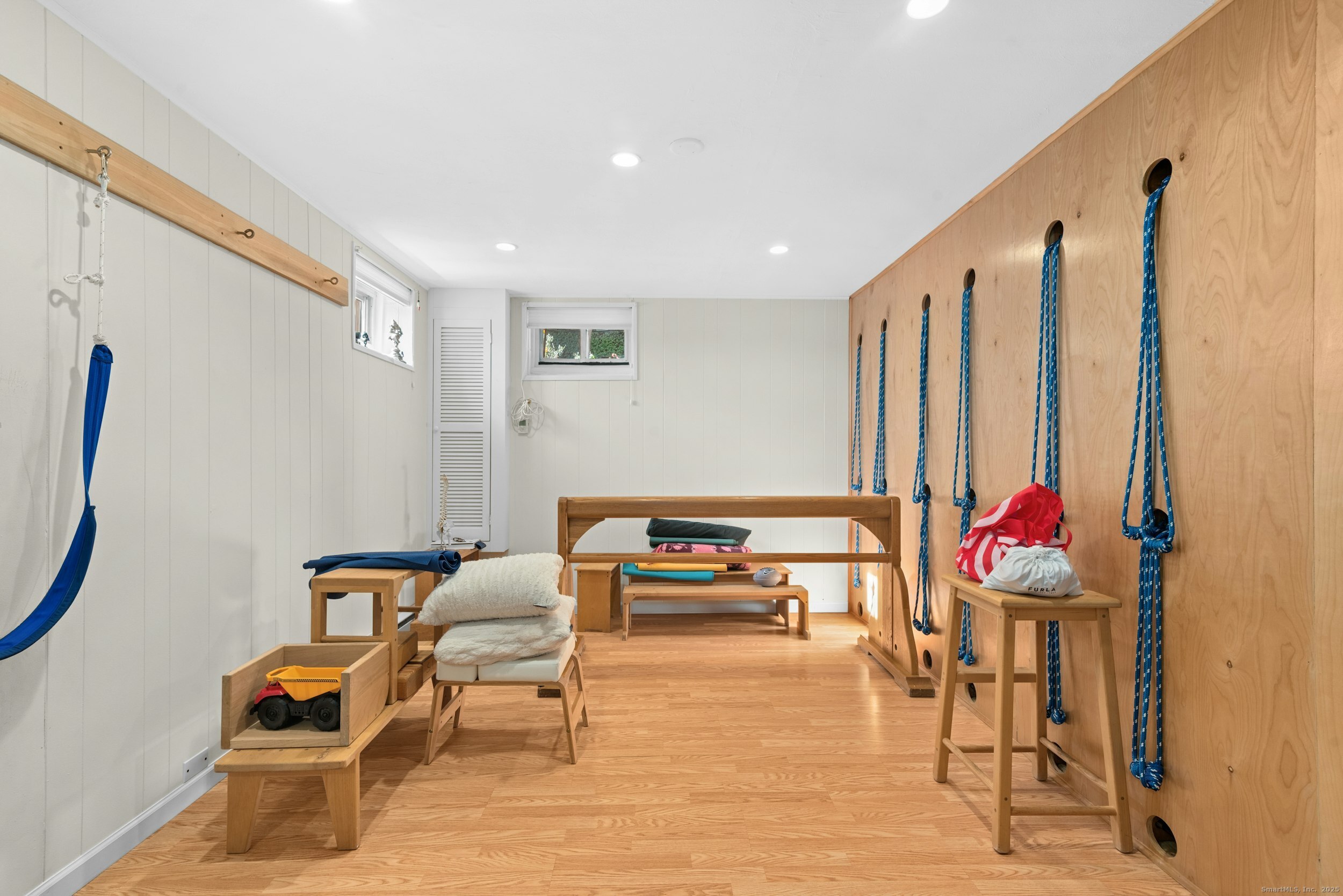 85 Hirsch Road Stamford, CT 06905 - Photo 21 of 27 a living room with furniture and a couch