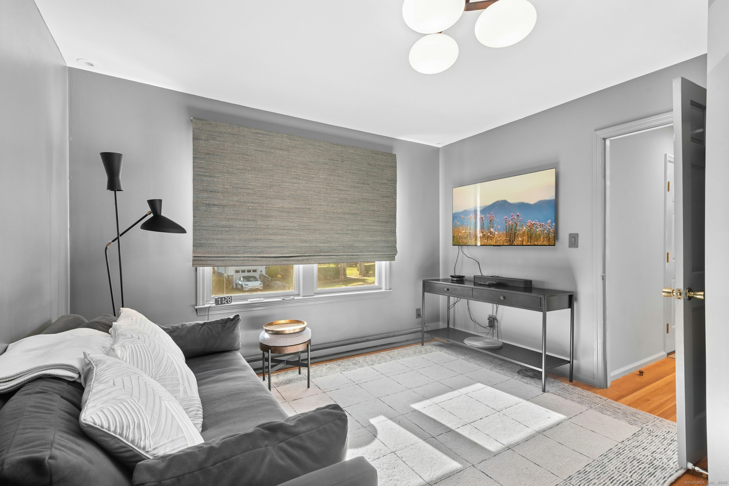 85 Hirsch Road Stamford, CT 06905 - Photo 6 of 27 a living room with furniture and a window