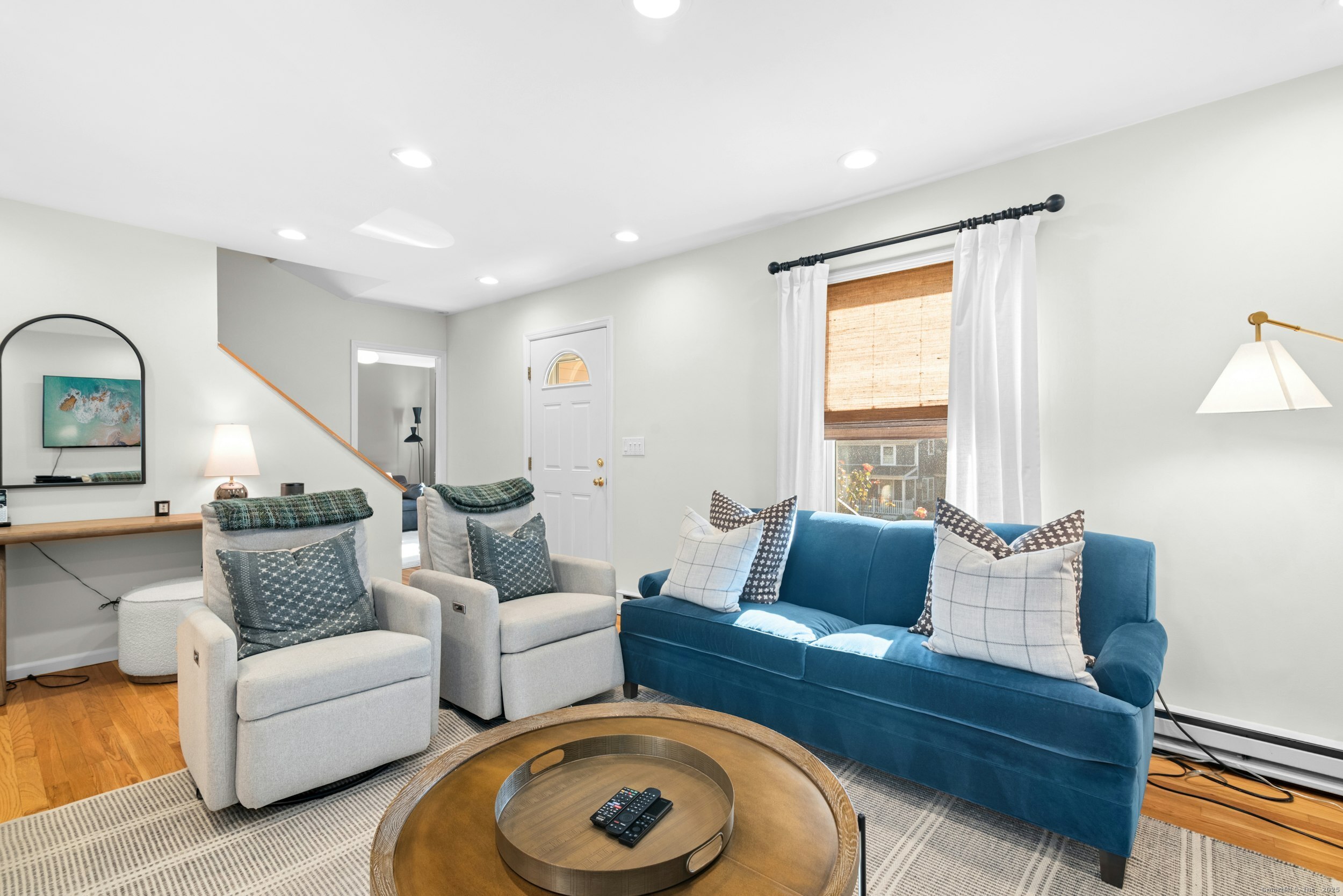 85 Hirsch Road Stamford, CT 06905 - Photo 7 of 27 a living room with furniture and wooden floor