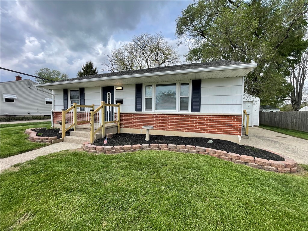 1361 Sussex Road Troy, OH 45373 - Photo 4 of 25 This charming residence features a well-maintained exterior, perfect for comfortable living.
