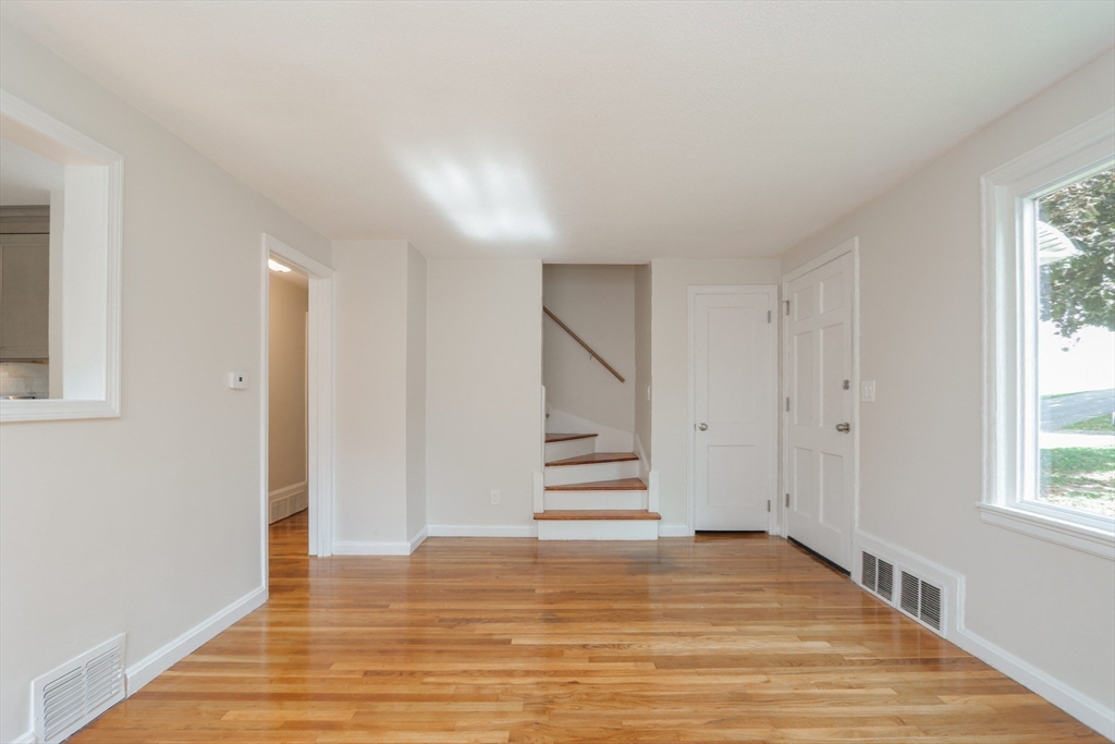 32 Lotus Street West Springfield, MA 01089 - Photo 11 of 42 a view of empty room with wooden floor and window