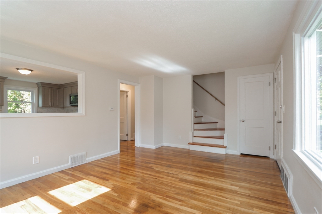32 Lotus Street West Springfield, MA 01089 - Photo 12 of 42 a view of empty room with wooden floor and fan