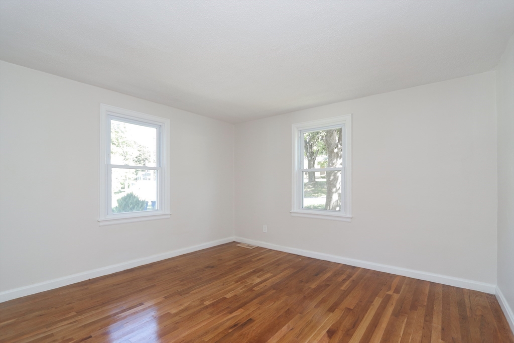 32 Lotus Street West Springfield, MA 01089 - Photo 14 of 42 an empty room with wooden floor and windows