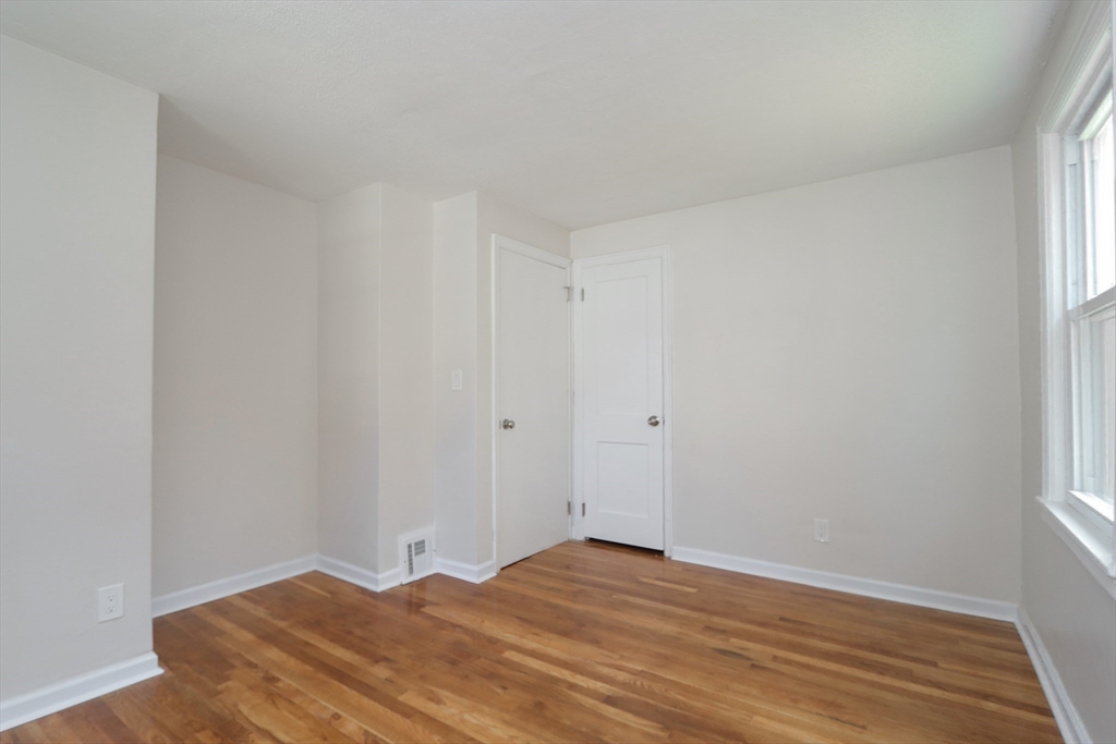 32 Lotus Street West Springfield, MA 01089 - Photo 19 of 42 a view of empty room with wooden floor and fan