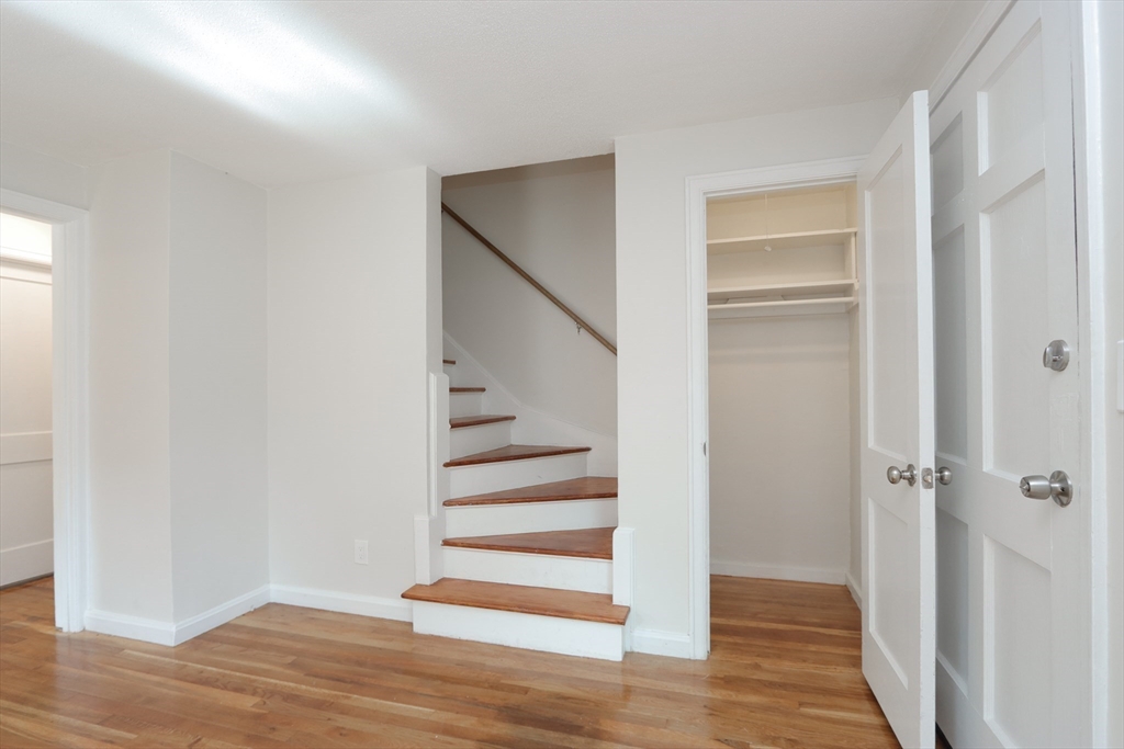 32 Lotus Street West Springfield, MA 01089 - Photo 22 of 42 a view of a hallway with wooden floor and entryway