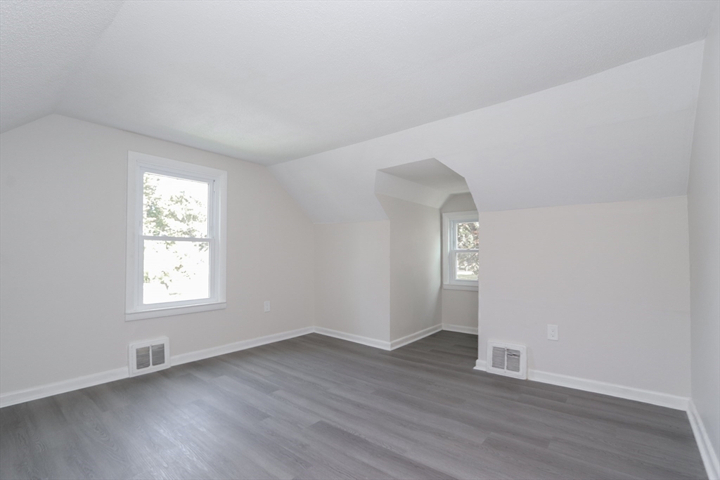 32 Lotus Street West Springfield, MA 01089 - Photo 29 of 42 an empty room with wooden floor and windows