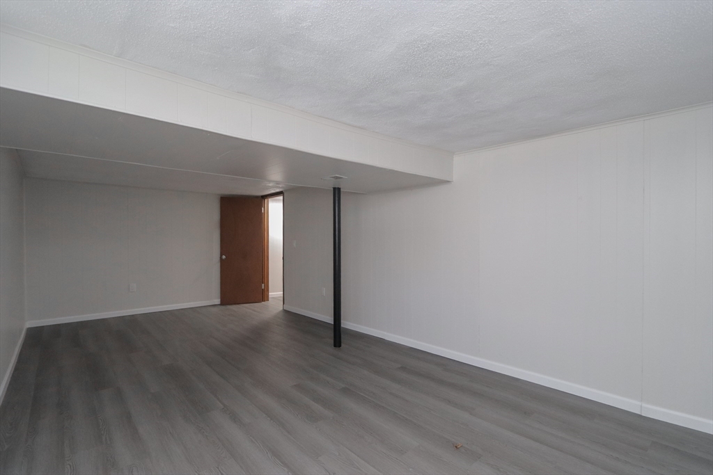 32 Lotus Street West Springfield, MA 01089 - Photo 34 of 42 a view of an empty room with wooden floor