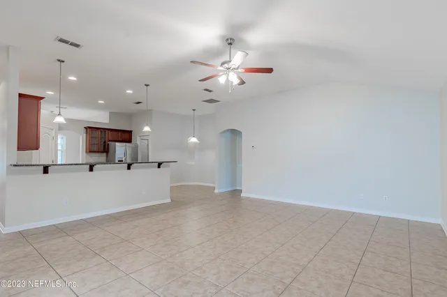a view of a kitchen with a sink and a chandelier