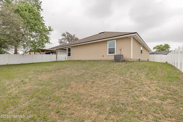 view of a house with a yard