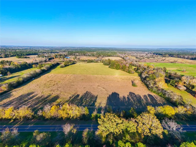 an aerial view of residential building and lake