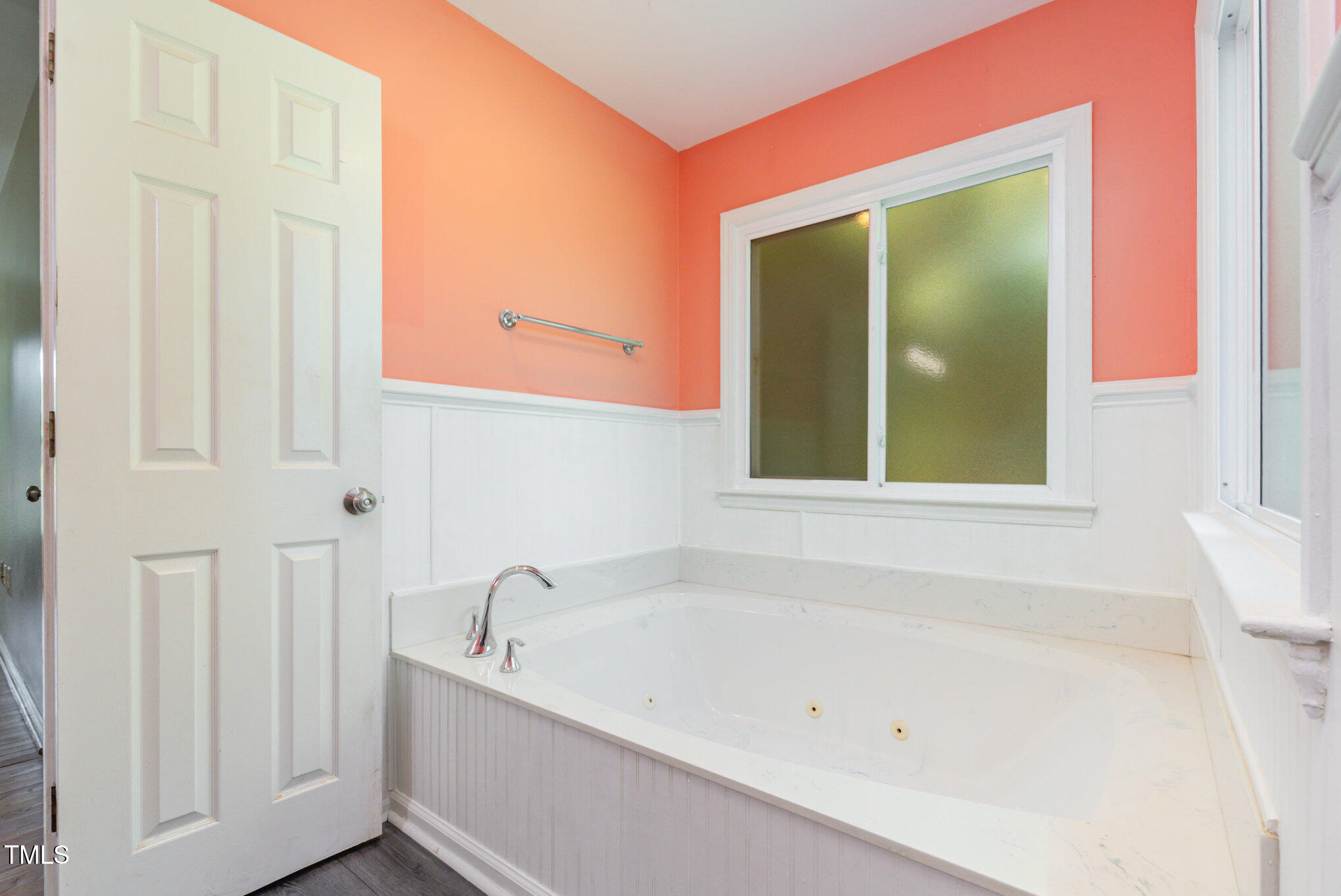 823 Shadow Lake Drive Willow Spring, NC 27592 - Photo 17 of 31 a bathroom with bathtub and window