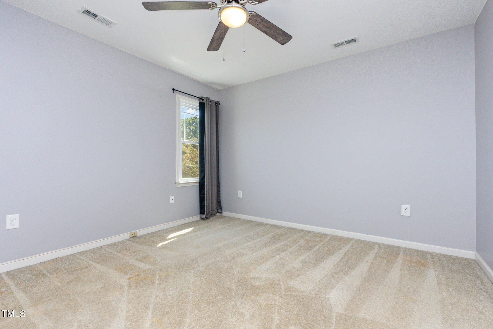 823 Shadow Lake Drive Willow Spring, NC 27592 - Photo 20 of 31 a view of an empty room with a window