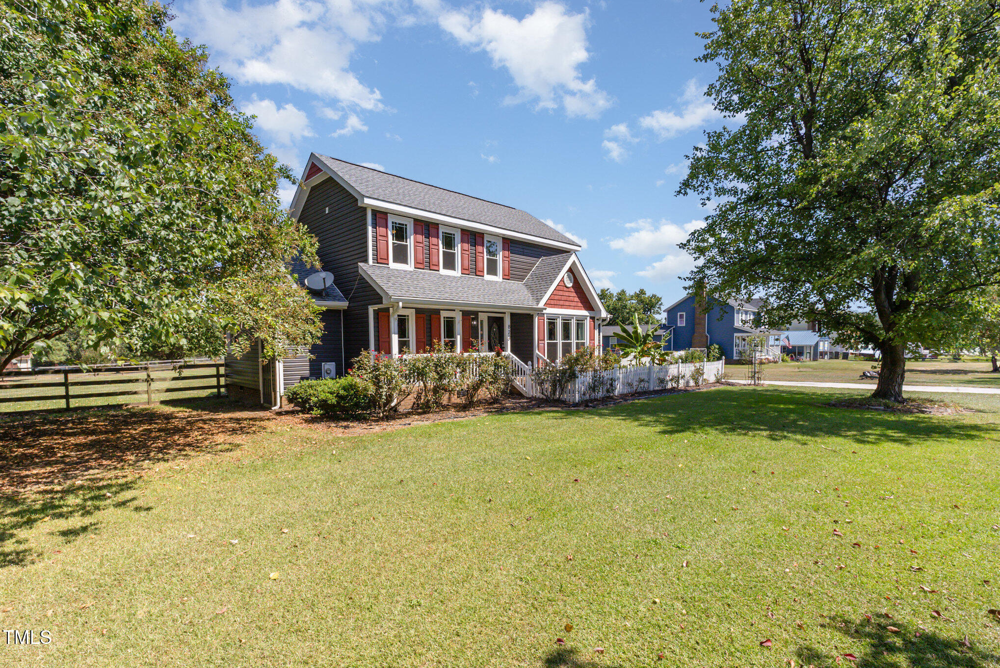 823 Shadow Lake Drive Willow Spring, NC 27592 - Photo 2 of 31 a front view of a house with a yard