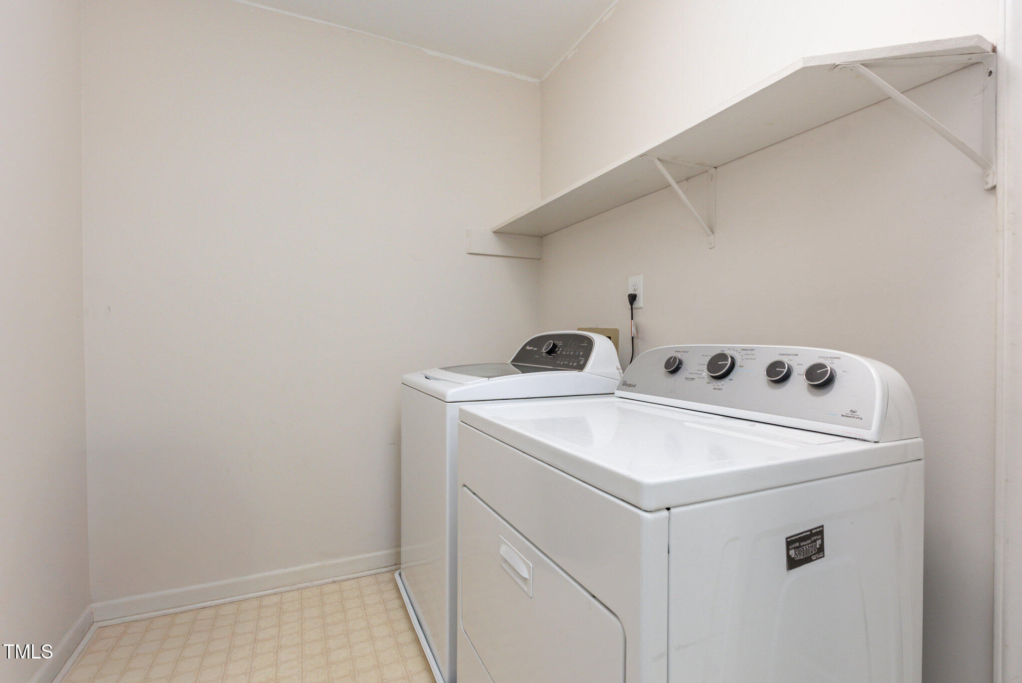 823 Shadow Lake Drive Willow Spring, NC 27592 - Photo 21 of 31 a utility room with dryer and washer