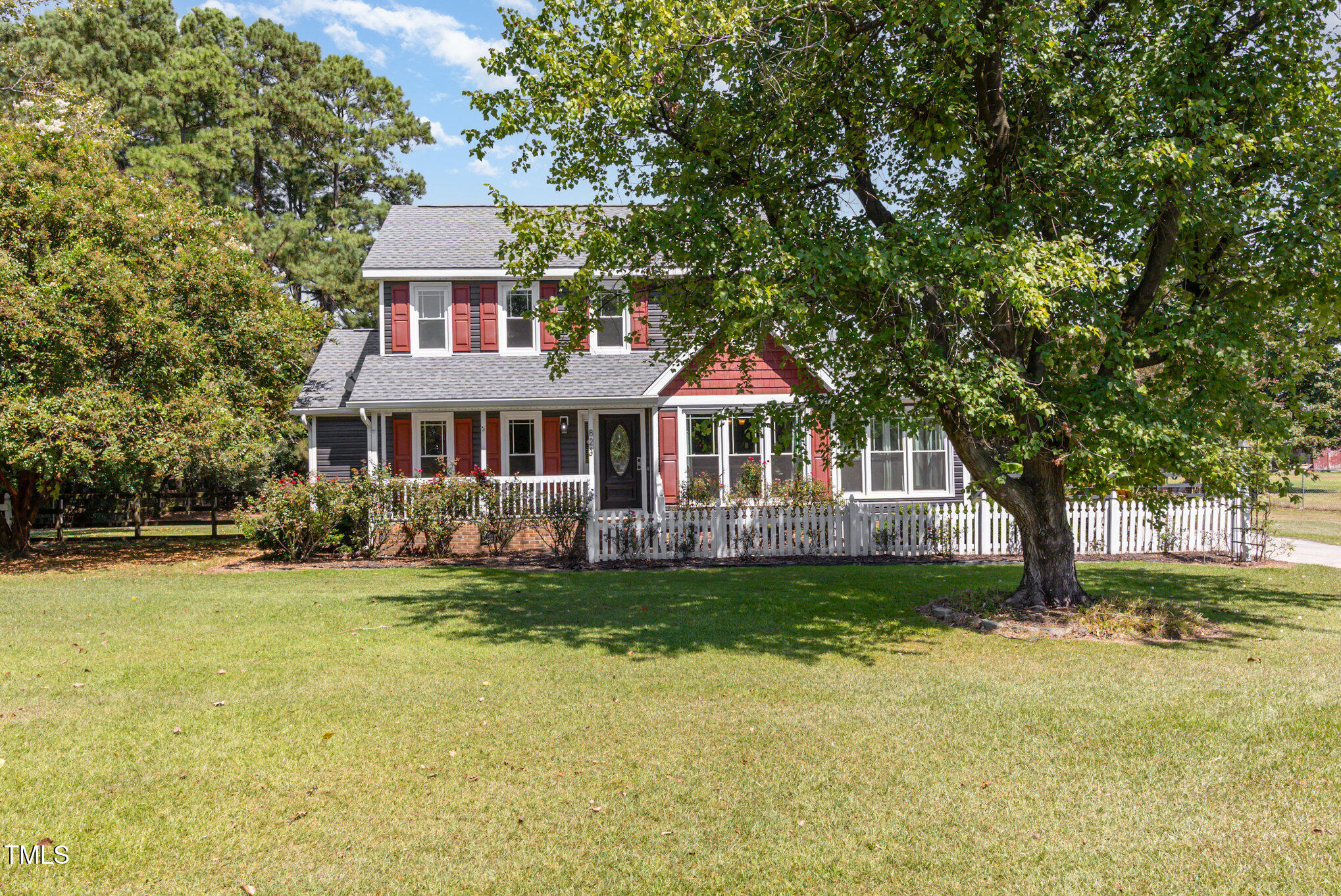 823 Shadow Lake Drive Willow Spring, NC 27592 - Photo 3 of 31 a front view of a house with a garden