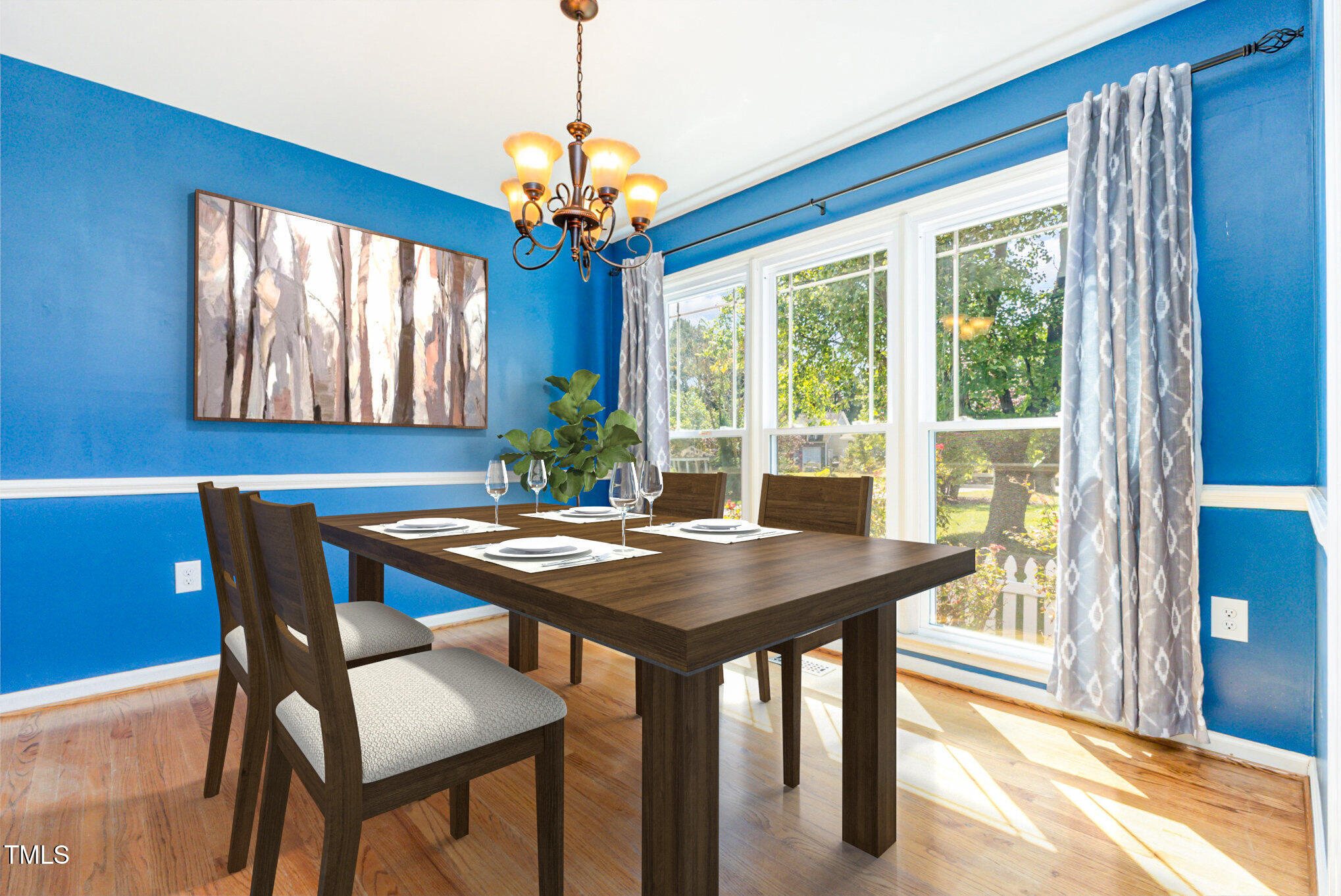 823 Shadow Lake Drive Willow Spring, NC 27592 - Photo 5 of 31 a view of a dining room with furniture a chandelier and wooden floor