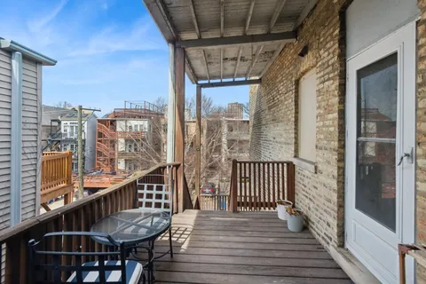 a view of balcony with furniture