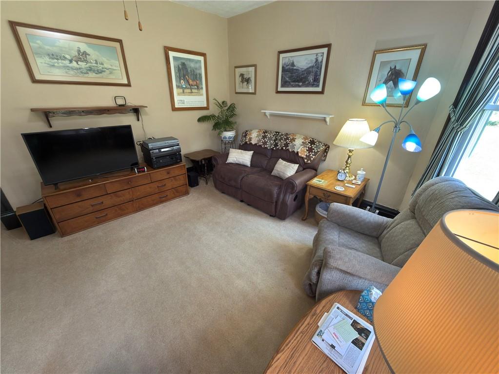 122 Coal Bank Road Greenville, PA 16125 - Photo 37 of 50 a living room with furniture and a flat screen tv