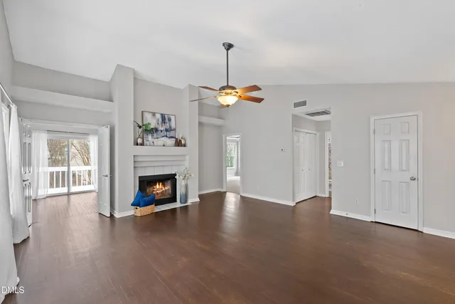 a view of an empty room and fire place