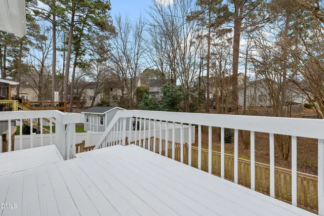 a kitchen with stainless steel appliances granite countertop a refrigerator stove top oven a sink and dishwasher