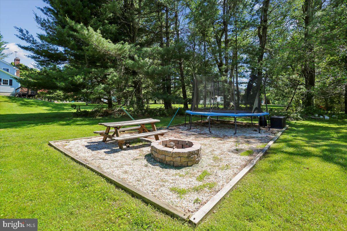 20920 Sunnyacres Road Gaithersburg, MD 20882 - Photo 59 of 64 Firepit and trampoline play area
