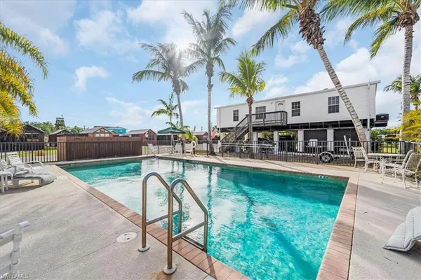 a view of a swimming pool with a lounge chairs