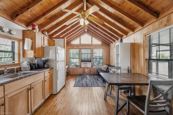 a open kitchen with dining table and chairs