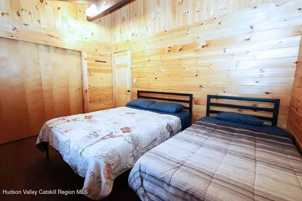 a bedroom with double bed and a window