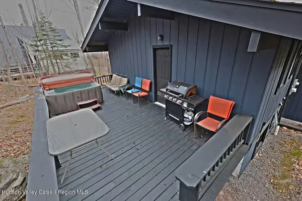 a sitting area with furniture and wooden floor