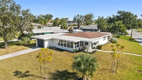 an aerial view of a houses with ocean view