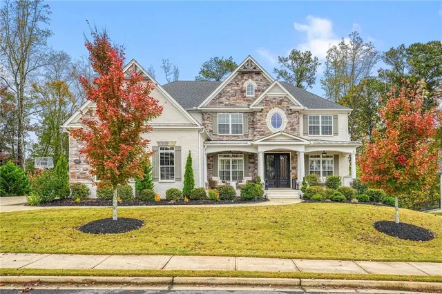 a front view of a house with a yard