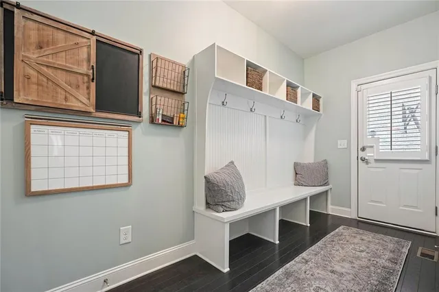 a spacious bathroom with a tub sink and mirror